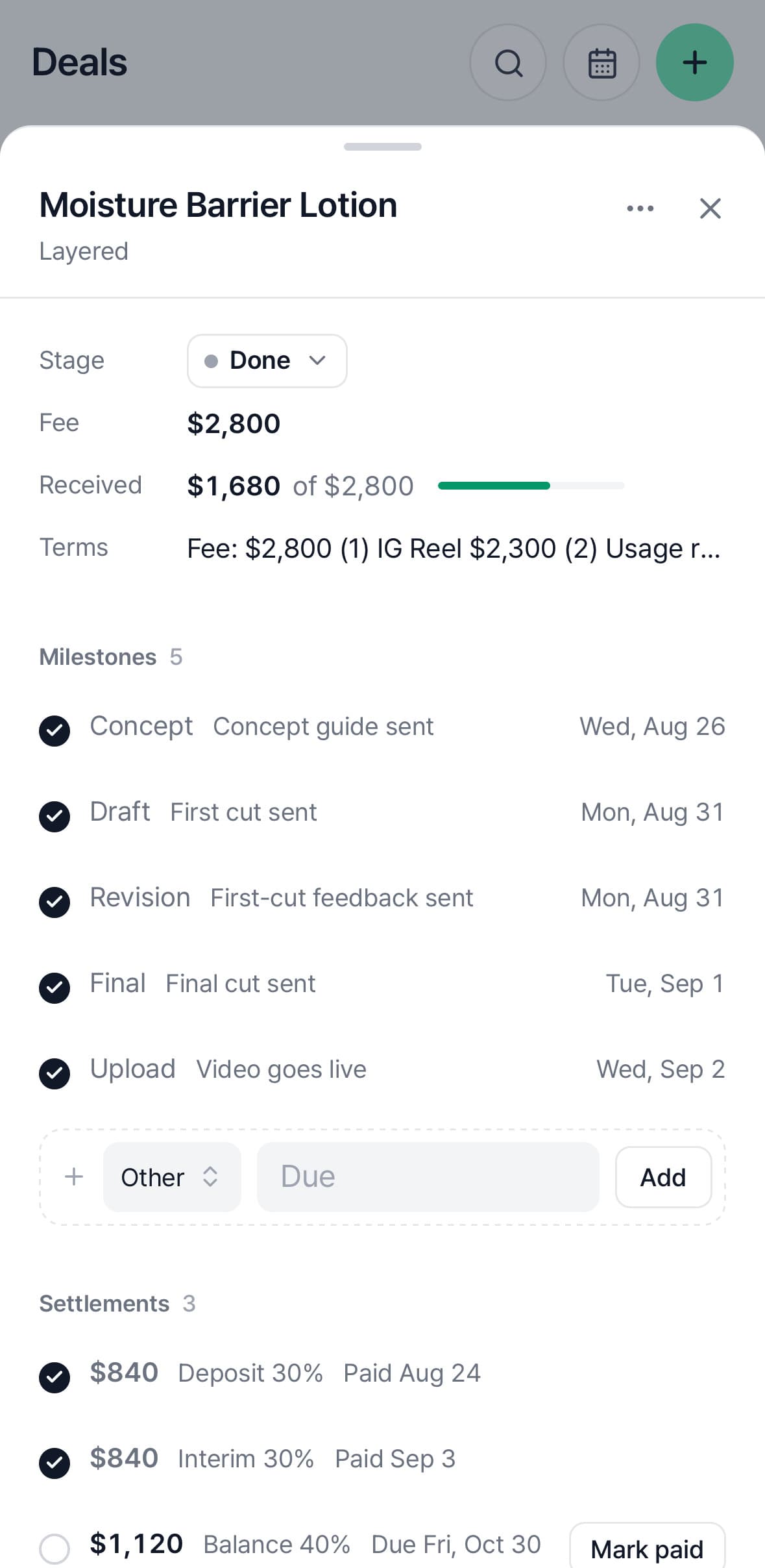 A deal on a phone — stage, fee, money received, five milestones and settlements